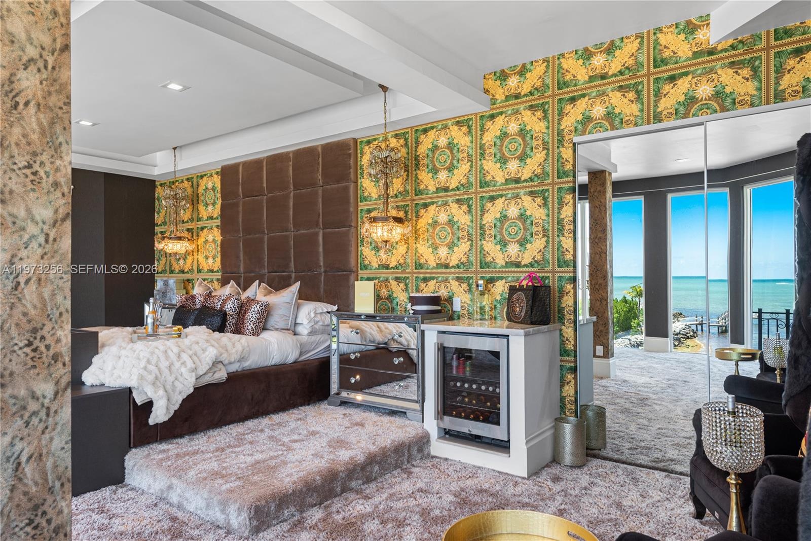 Living room with ocean views through floor-to-ceiling windows