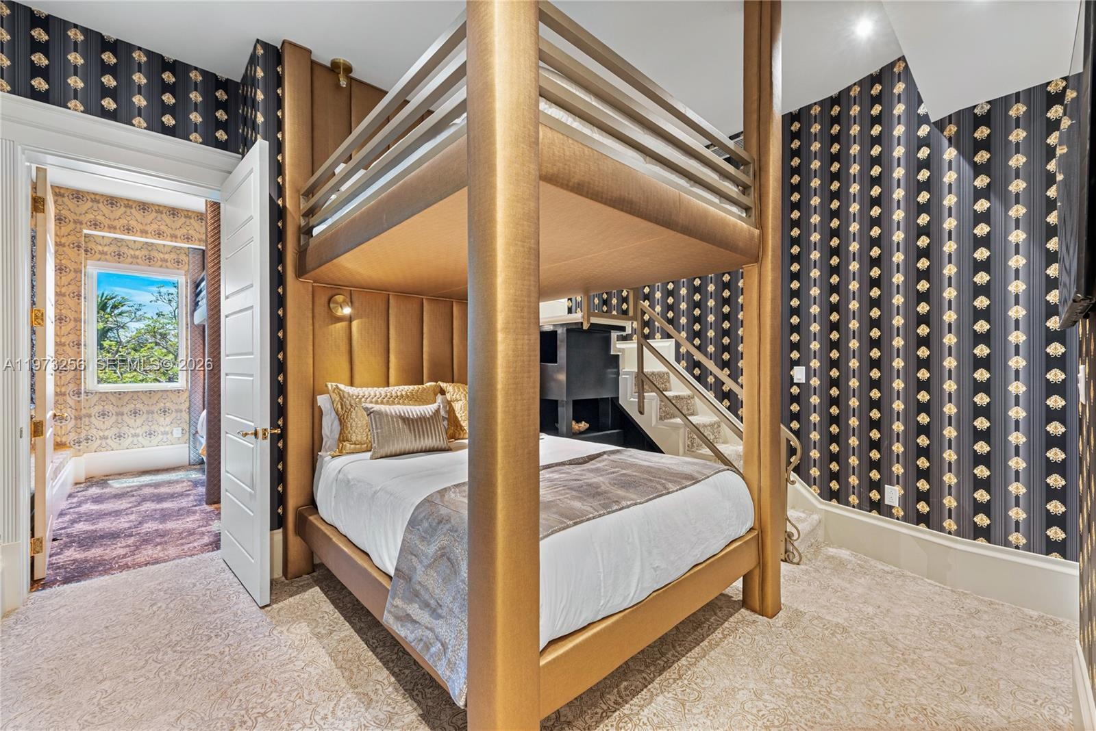 Ensuite bathroom with marble vanity and gold fixtures