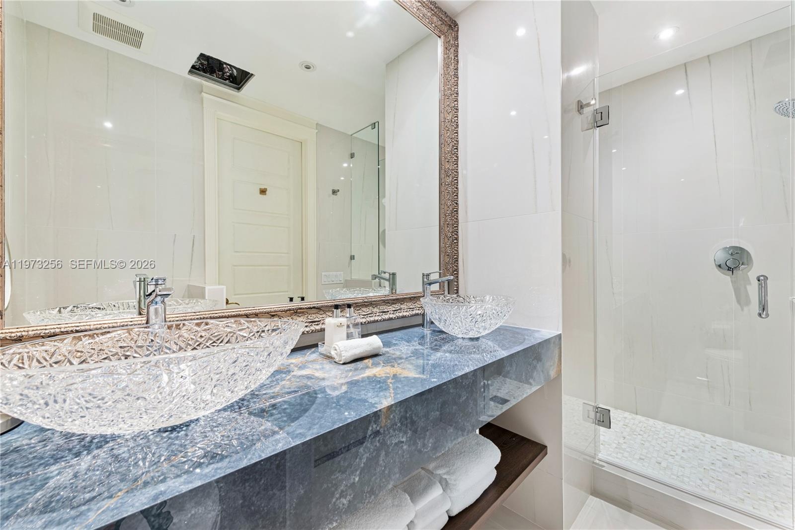 Luxury bathroom with blue mosaic accents